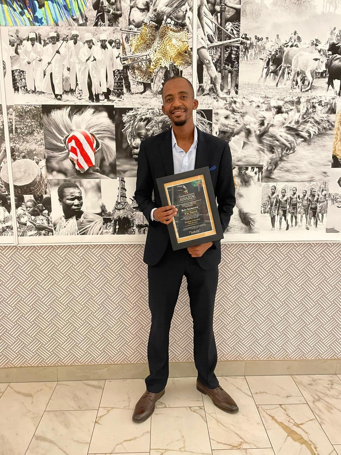 George M'sapenda holding the Ballo Innovations Company of the Year certificate